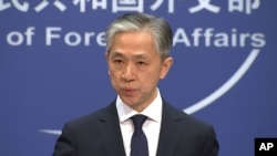 FILE - Chinese Foreign Ministry spokesman Wang Wenbin speaks during a press conference in Beijing, Nov. 13, 2020.