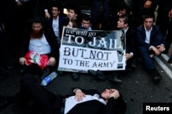 Ultra-Orthodox Jewish men protest after an Israeli Supreme Court ruling that requires the state to begin drafting ultra-Orthodox Jewish seminary students to the military, in Bnei Brak, Israel, on July 16, 2024.