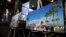 Los Angeles Rams Chief Operating Officer Kevin Demoff speaks behind an illustration of the Rams' planned new stadium at a celebration to welcome NFL team, the Los Angeles Rams, at the Forum in Inglewood, California, Jan. 15, 2016.