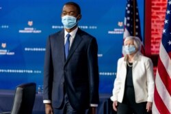 Wally Adeyemo who President-elect Joe Biden nominated to serve as Deputy Secretary of the Treasury, left, Janet Yellen, right, arrive for a news conference at The Queen theater, Dec. 1, 2020, in Wilmington, Del.