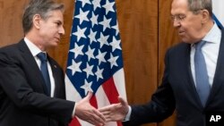 U.S. Secretary of State Antony Blinken (left) with Russian Foreign Minister Sergei Lavrov in Geneva, Jan. 21, 2022.