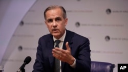 FILE - Bank of England Governor Mark Carney speaks during an Inflation Report Press Conference at the Bank of England in London, May 2, 2019. 