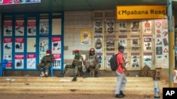 Security forces patrol the streets near opposition leader Bobi Wine headquarters in Kampala, Uganda Jan. 13, 2021 a day before the Jan. 14 elections. 