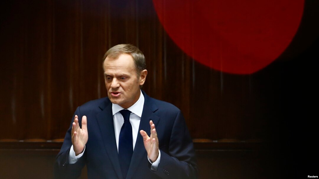 Poland's Prime Minister Donald Tusk gestures as he delivers a speech at parliament in Warsaw, August 27, 2014.