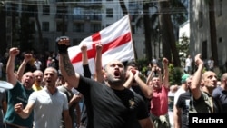 Anti-LGBT protesters shout as they take part in a rally ahead of the planned March for Dignity during Pride Week in Tbilisi, Georgia, July 5, 2021.