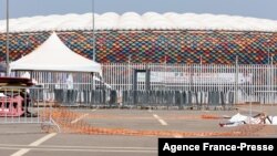 Barriers on the ground at the scene of the stampede are seen at the entrance of Olembe stadium in Yaounde, Jan. 25, 2022. Eight people were killed and many more injured in a crush outside a Cameroonian football stadium, Jan. 24, 2022, before an Africa Cup