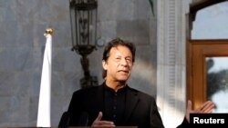 Pakistan's Prime Minister Imran Khan speaks during a joint news conference with Afghan President Ashraf Ghani (not pictured), at the presidential palace in Kabul, Afghanistan, Nov. 19, 2020.