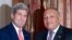 U.S. Secretary of State John Kerry, left, greets Egypt's Foreign Minister Sameh Shoukry in Cairo October 12, 2014.