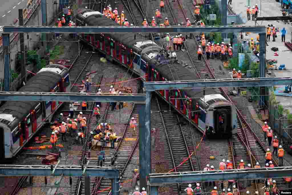 A Mass Transit Railway (MTR) train is seen derailed on the East Rail line in Hong Kong, China.