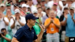 Jordan Spieth celebrates after winning the Masters golf tournament Sunday, April 12, 2015, in Augusta, Ga.