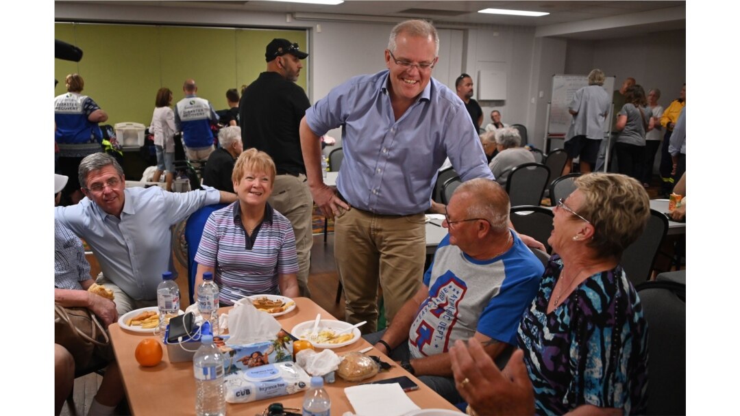 Australian Prime Minister Scott Morrison (L) speaks to residents at an evacuation center in Taree, 350km north of Sydney on Nov. 10, 2019.