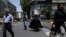 Iranian pedestrians cross Jomhouri-e-Eslami (Islamic Republic) St. in downtown Tehran, Iran, June 9, 2018.