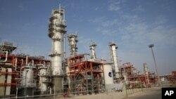 FILE - This March 16, 2019 file photo, shows a natural gas refinery at the South Pars gas field on the northern coast of the Persian Gulf, in Asaluyeh, Iran. China's state oil company has pulled out of a $5 billion deal to develop a portion of Iran…