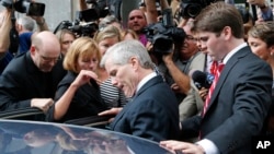 Former Virginia Gov. Bob McDonnell, center, he gets into a car with his son, Bobby, right, after McDonnell and his wife, former first lady Maureen McDonnell, were convicted on multiple counts of corruption at Federal Court in Richmond, Va., Sept. 4, 2014.