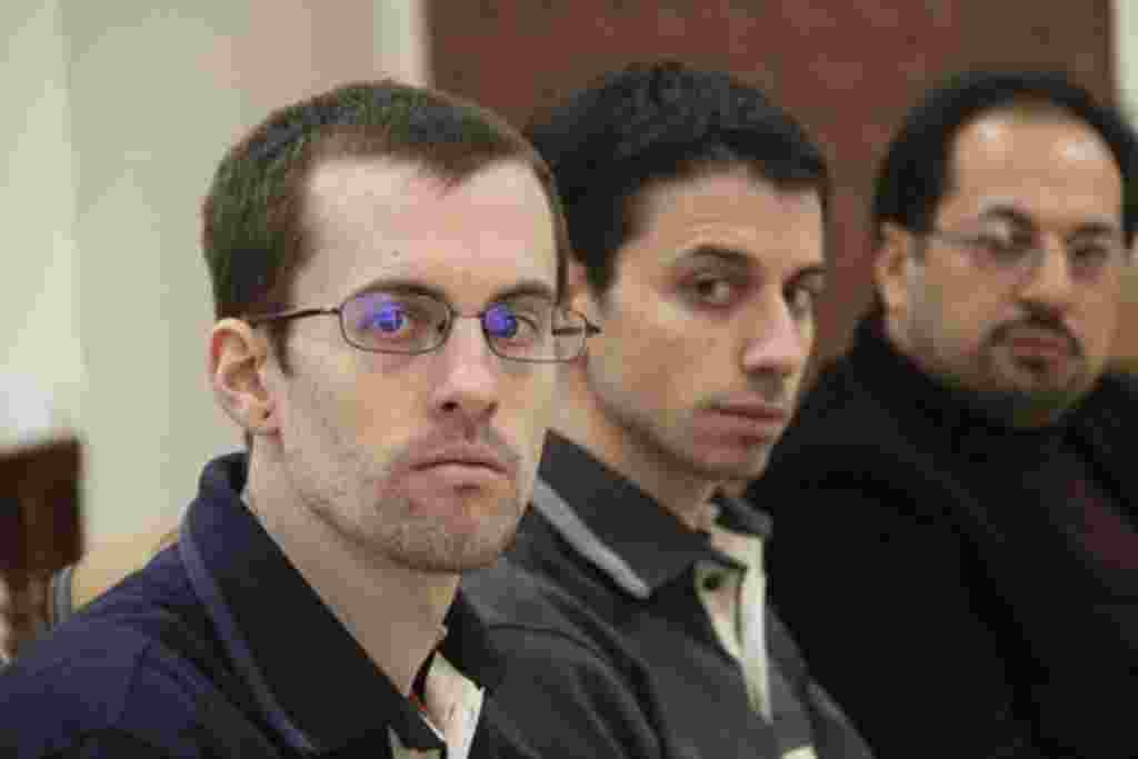 American hikers Shane Bauer (L) and Josh Fattal and their translator attend the first session of their trial in Tehran (file photo)
