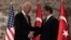 U.S. Vice President Joe Biden, left, and Turkish Prime Minister Ahmet Davutoglu shake hands before a meeting in Istanbul, Turkey, Nov. 21, 2014. 