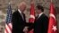 U.S. Vice President Joe Biden, left, and Turkish Prime Minister Ahmet Davutoglu shake hands before a meeting in Istanbul, Turkey, Nov. 21, 2014. 