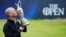American Brian Harman poses for the media as he holds the Claret Jug trophy after winning the British Open Golf Championships at the Royal Liverpool Golf Club in Hoylake, England, July 23, 2023.