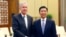 China's Vice President Li Yuanchao and U.S. Deputy Secretary of State William Burns (L) pose for a photo as they shake hands during a meeting at the Great Hall of the People in Beijing, January 22, 2014.
