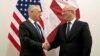 U.S. Secretary of Defense James Mattis, left, greets Georgia's Defense Minister Levan Izoria during a NATO defense ministers meeting at the Alliance headquarters in Brussels, Belgium, Oct. 3, 2018.