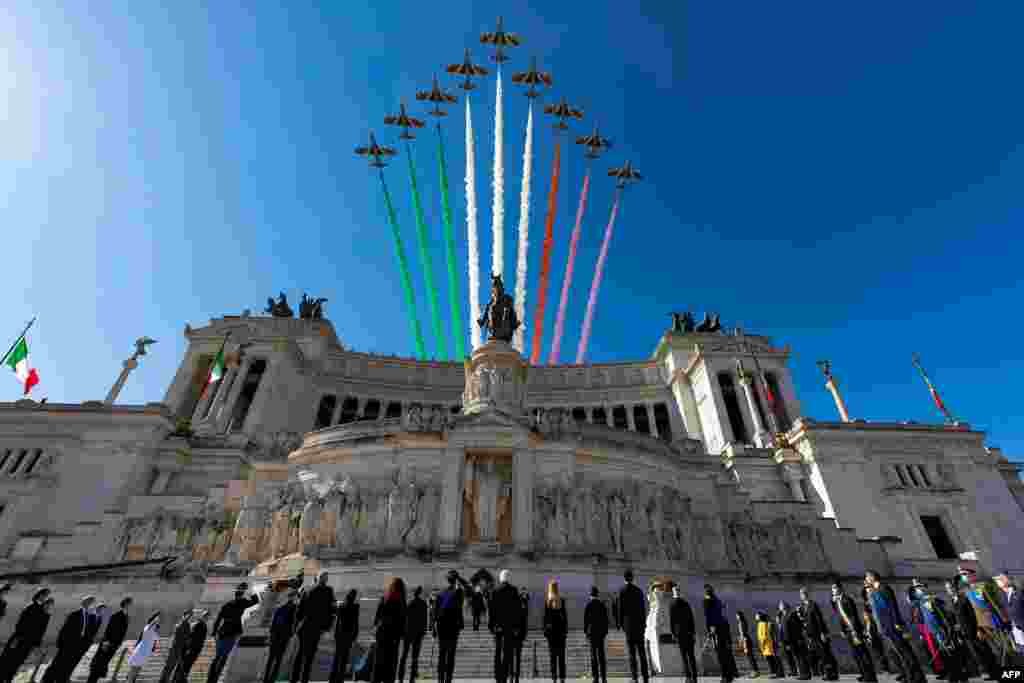 This handout photo by the press office of the Quirinale Presidential Palace in Rome shows the Italian Air Force acrobatic unit flying over the Vittorio Emanuele II National Monument as part of Republic Day ceremonies.