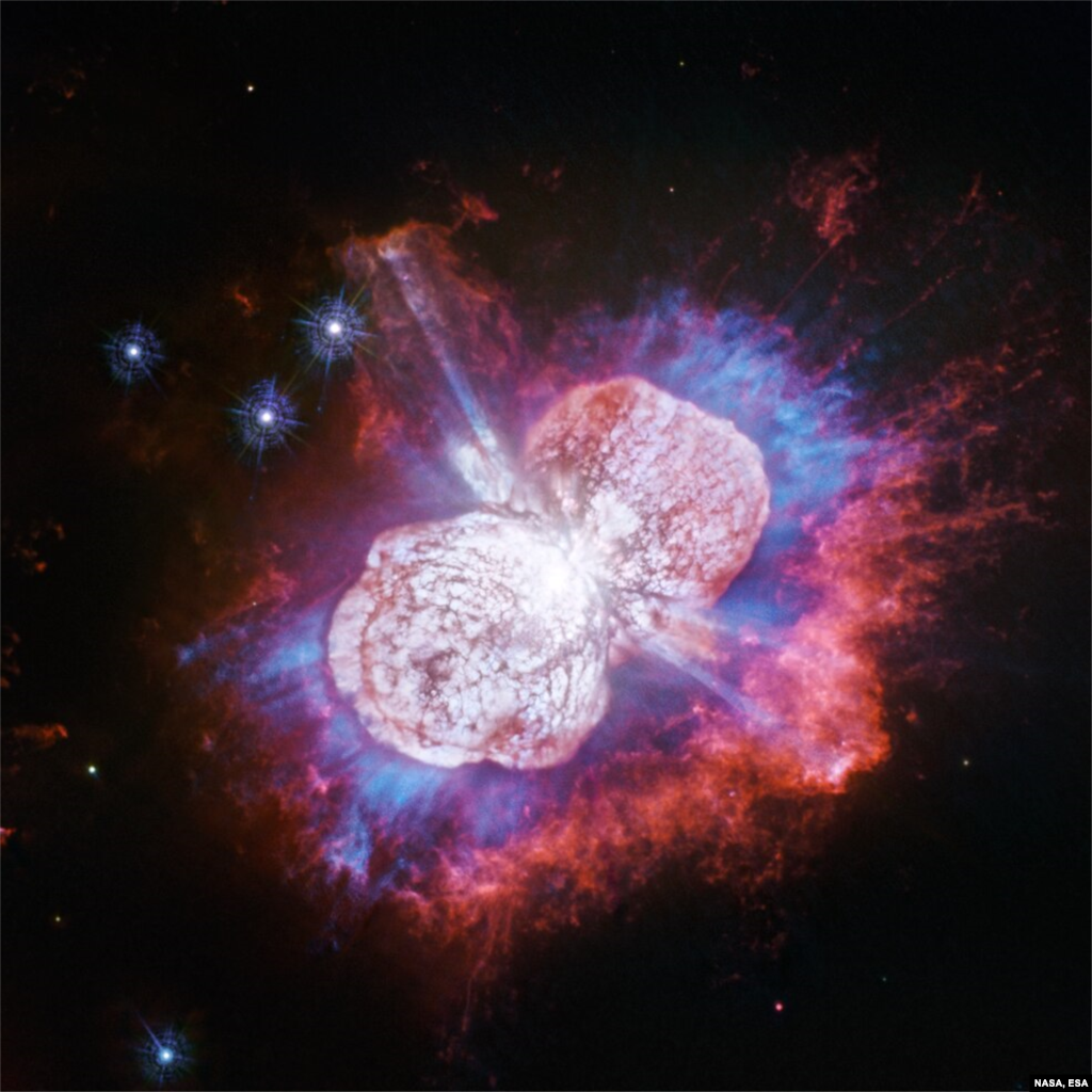 A new view from NASA&#39;s Hubble Space Telescope shows gases glowing in red, white and blue of Eta Carinae, the super-massive star which resides 7,500 light-years away. Credits: NASA, ESA, N. Smith (University of Arizona) and J. Morse (BoldlyGo Institute)