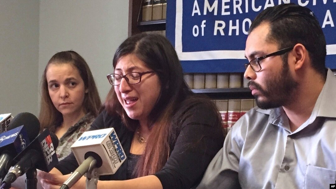 FILE - Lilian Calderon, center, cries as she describes her experiences while in custody, alongside her husband, Luis Gordillo, right, during a news conference at the office of the American Civil Liberties Union in Providence, R.I., Feb. 14, 2018. Calderon was detained by Immigration and Customs Enforcement after an interview designed to confirm her marital relationship.