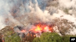 An image provided by the U.S. Geological Survey shows lava spattering from an area between active Fissures 16 and 20 at 8:20 a.m. HST, on lower east rift of the Kilauea volcano, near Pahoa, Hawaii, May 16, 2018.