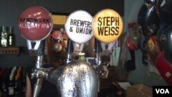 The tap at the Stanley Beer Yard in Johannesburg, South Africa. Lucy Corne, the author of African Brew, expects the number of craft breweries in the country to top 100 next year. (Peter Cox for VOA)