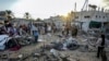 Palestinians inspect the damage at a tent area in the courtyard of Al Aqsa Martyrs Hospital, hit by an Israeli bombardment on Deir al-Balah, central Gaza Strip, Sept. 5, 2024.