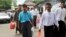 Burmese political prisoners who were released from Insein prison walk away from the facility, May 17, 2013 in Rangoon. 
