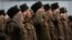 FILE - North Korean soldiers salute before the statues of North Korea's late leader Kim Jong Il, and his father, North Korea's founder Kim Il Sung, in Pyongyang, North Korea, Feb. 16, 2014.