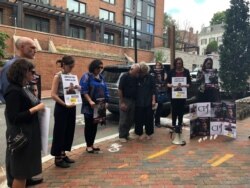 About two dozen people gather for Christopher Allen’s two-year memorial, outside the South Sudanese embassy in Washington, Aug. 26, 2019. (A.Bior/VOA)
