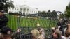 Protesters pile barricades in front of the White House in Washington, Oct. 13, 2013.