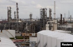 FILE - An oil refinery and storage facility is pictured south of downtown Houston, January 30, 2012.