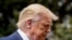 President Donald Trump pauses while speaking with members of the media before boarding Marine One on the South Lawn of the White House in Washington, Aug. 6, 2020.