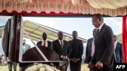 President of Kenya William Ruto stands next to the coffin of Kelvin Kiptum while attending the funeral proceedings of the late marathon runner in Chepkorio on February 23, 2024.