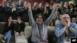 Friends and relatives of Ohad Ben Ami and Eli Sharabi, who were taken from kibbutz Beeri during the Oct. 7, 2023, attack, react as they watch the live broadcast of their release from Hamas captivity in Gaza, at the Kibbutz Beeri, Israel, Feb. 8, 2025.