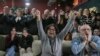 Friends and relatives of Ohad Ben Ami and Eli Sharabi, who were taken from kibbutz Beeri during the Oct. 7, 2023, attack, react as they watch the live broadcast of their release from Hamas captivity in Gaza, at the Kibbutz Beeri, Israel, Feb. 8, 2025.