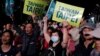 Supporters of the ruling Democratic Progressive Party react during a campaign rally for the local elections, in Taipei, Taiwan, Nov. 21, 2018.