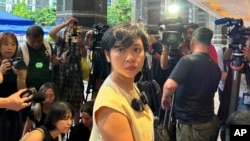 FILE - Selina Cheng, chairperson of the Hong Kong Journalists Association, speaks to media in Hong Kong on July 17, 2024.