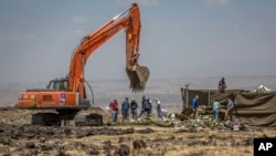 Investigators continue recovery work at the scene where the Ethiopian Airlines Boeing 737 Max 8 crashed shortly after takeoff on Sunday killing all 157 on board, near Bishoftu, south-east of Addis Ababa, Ethiopia, March 15, 2019.