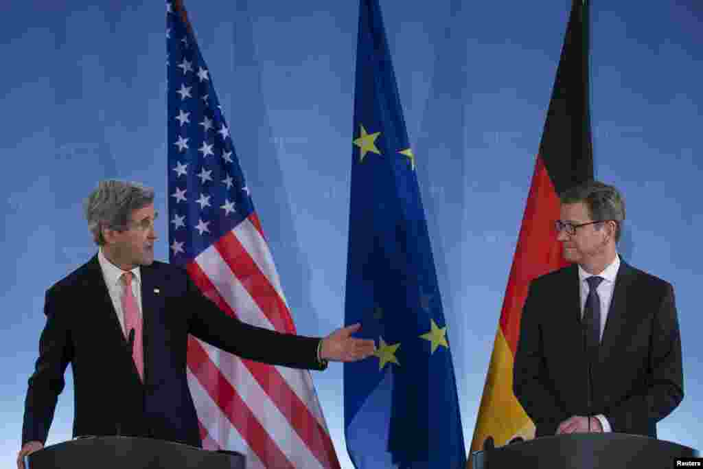 German Foreign Minister Guido Westerwelle (R) and U.S. Secretary of State John Kerry attend a news briefing after talks at the foreign ministry in Berlin February 26, 2013. Kerry said in Berlin on Tuesday he hopes Iran will choose at talks with major powe