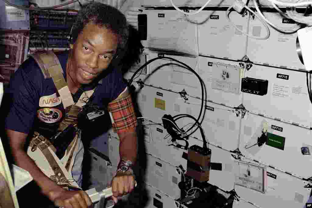 August 30 - September 5, 1983: The first African-American astronaut, Guion Bluford, joins the crew for Challenger’s third mission. This shuttle carried out the program’s first night launch and night landing. In this photo, Bluford is restrained by a har