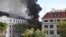 FILE - A fire burns at the Houses of Parliament, in Cape Town, South Africa, January 2, 2022. A man facing terrorism charges over the fire said in an courtroom outburst that he “burned it intentionally.” 