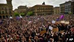 Thousands of people crowd at Plaza del Castillo during a protest in Pamplona, northern Spain, April 28, 2018. A court in Pamplona sentenced five men to nine years each in prison for sexual abuse in what activists saw as a gang rape during the 2016 running of the bulls festival in Pamplona.