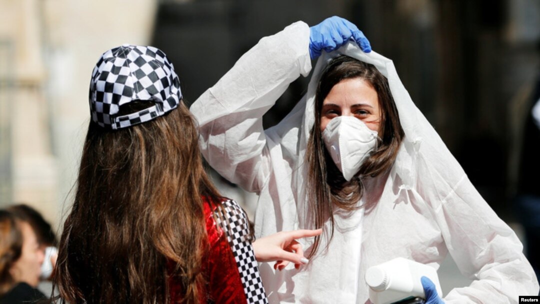 A teenager wears a costume as a reference to the coronavirus during the Jewish holiday of Purim, Jerusalem March 8, 2020.