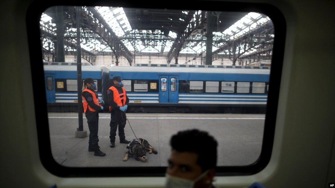Police guard a train station during a government-ordered lockdown to curb the spread of the new coronavirus in Buenos Aires, Argentina, April 24, 2020. 