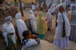 Worshippers gather outside a church complex in Axum, the holiest city for Orthodox Ethiopians, June 11, 2021. (Yan Boechat/VOA)