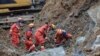 Rescuers work at the scene of a landslide which killed at least 14 people in Bijie, China's southwestern Guizhou province on Jan. 4, 2022.